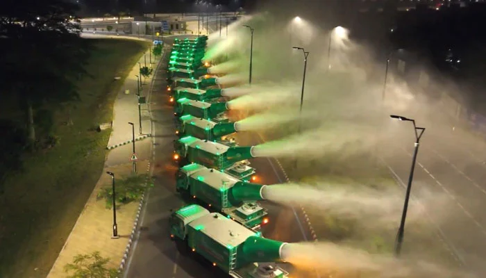 anti smog trucks sprinkling water mist on the roads of Lahore